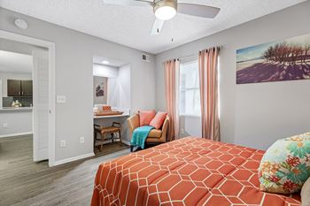 bedroom with ceiling fan and built-in desk area